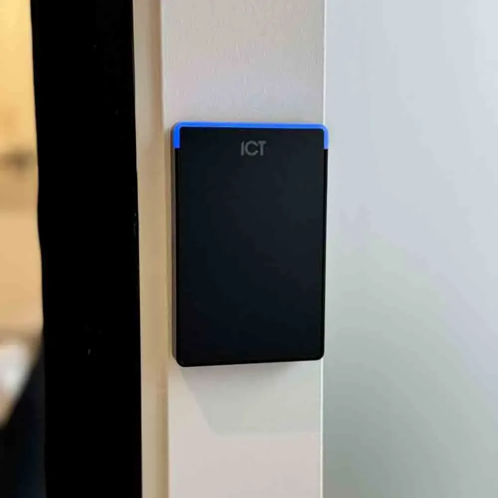 ICT access control card reader mounted on a door frame