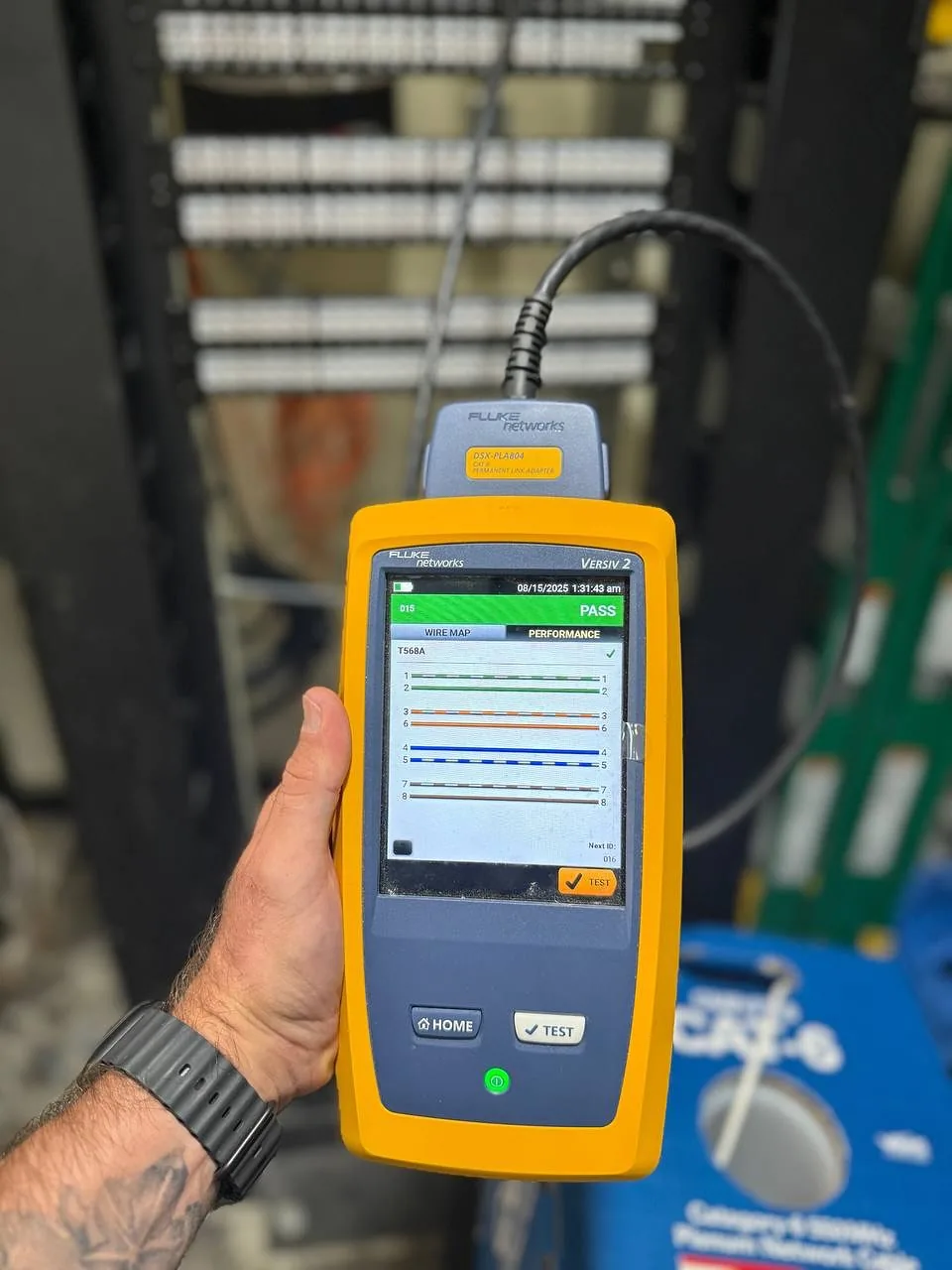 Fluke DSX Versiv 2 analyzer certifying a Cat6 line at a patch panel