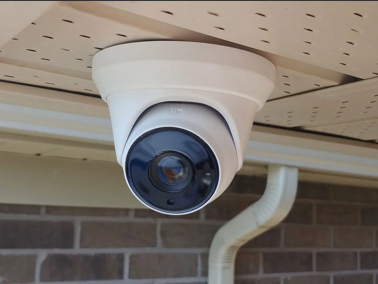 Turret camera under a soffit with conduit in Mississauga