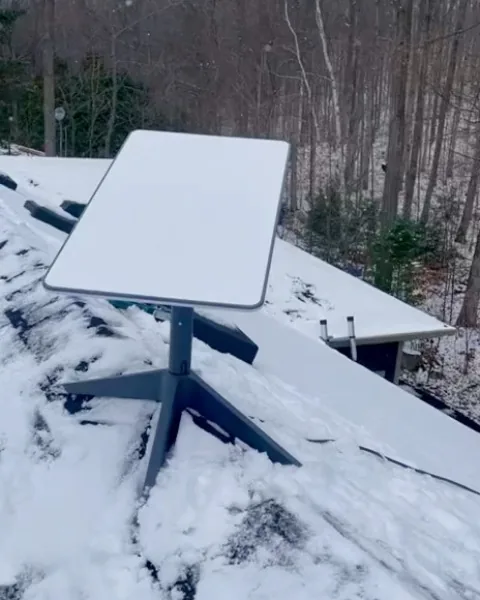 Starlink Dish on a Snowy Roof, video