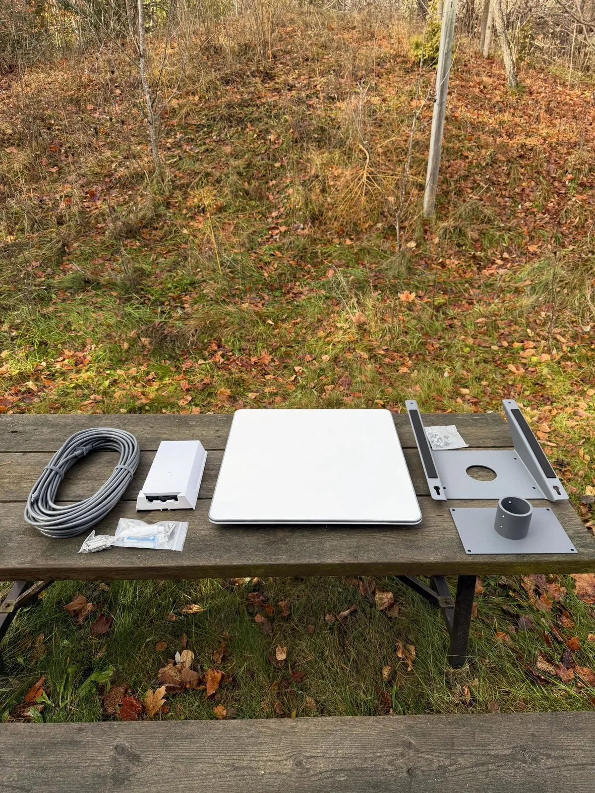 Starlink Performance kit components laid out on a picnic table before installation