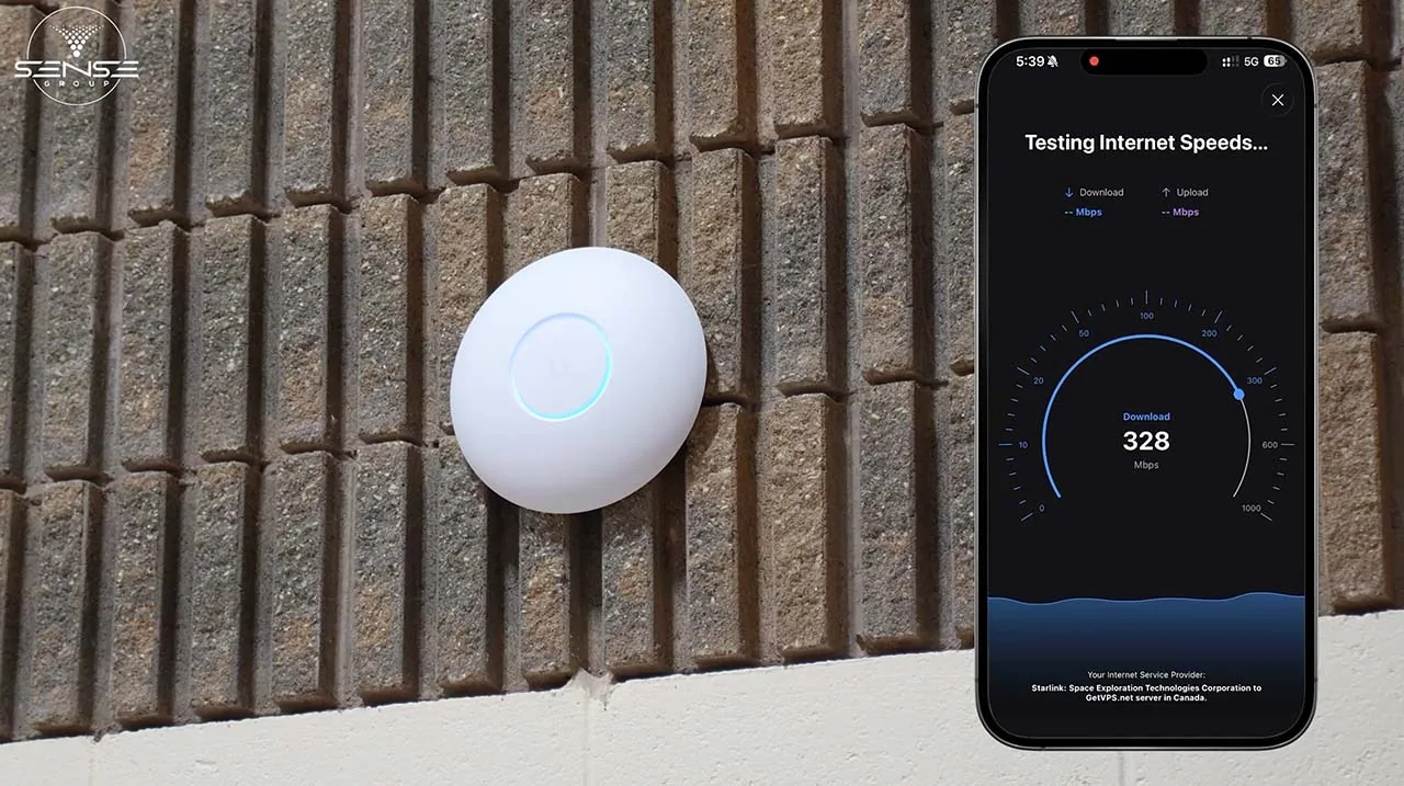 UniFi access point on the church wall with a phone speed test