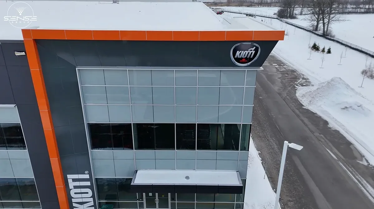 Aerial view of the KIOTI entrance with the company sign