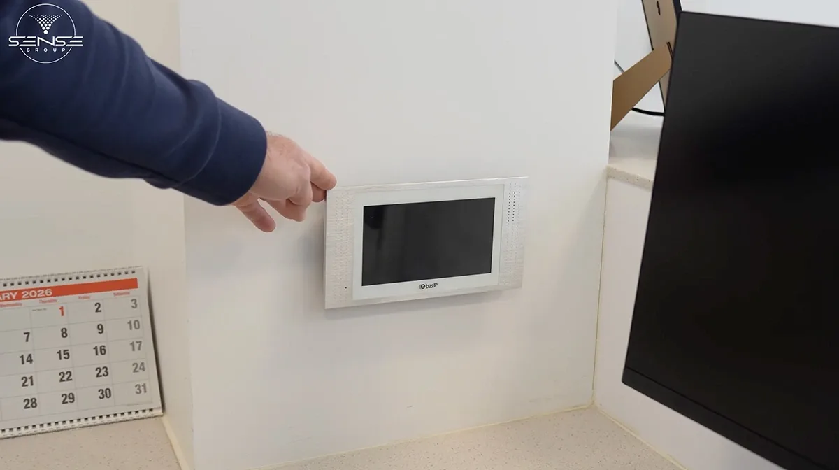 Wall-mounted video intercom monitor inside the office